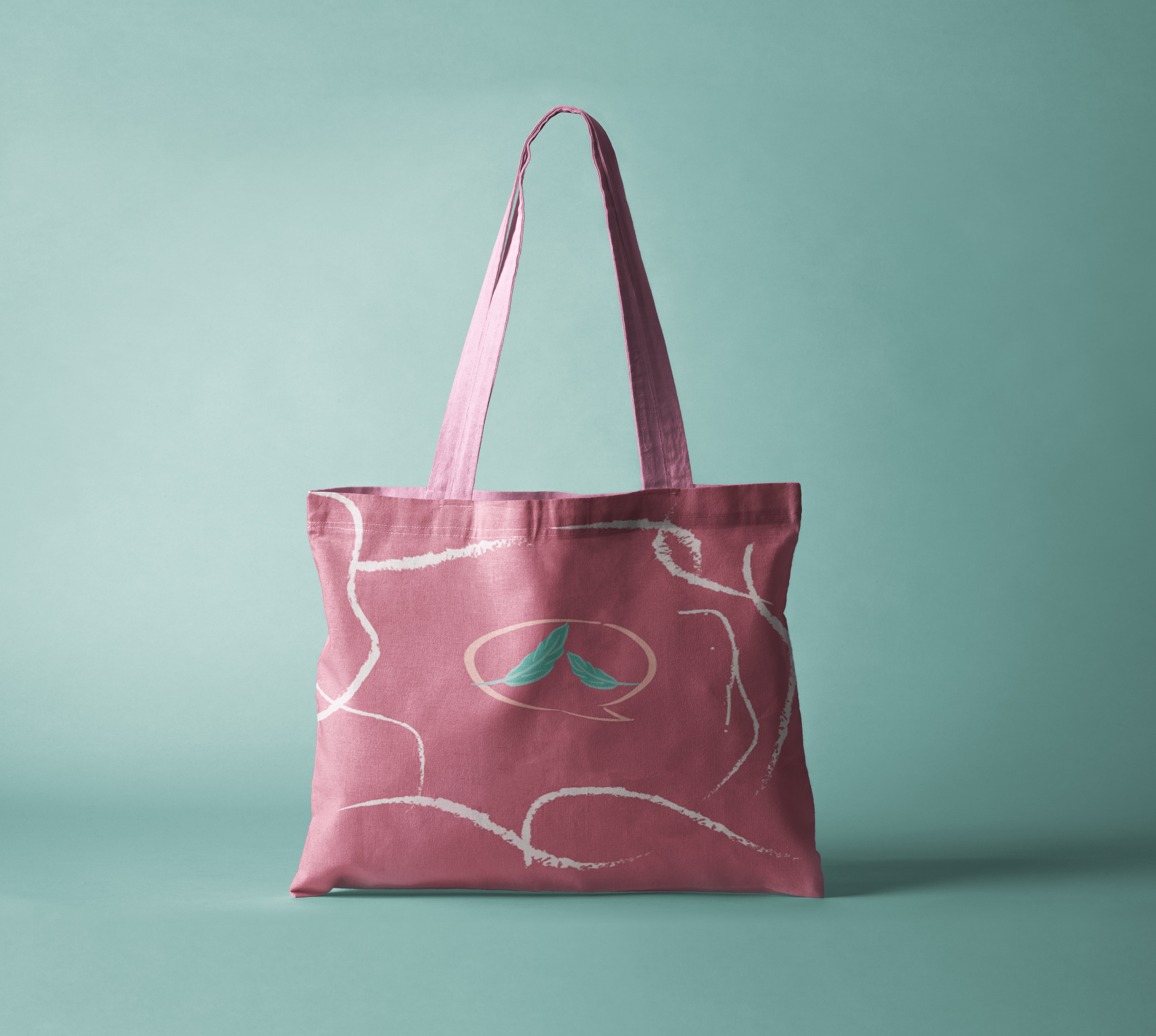 Feather pink tote-bag mockup on a teal background